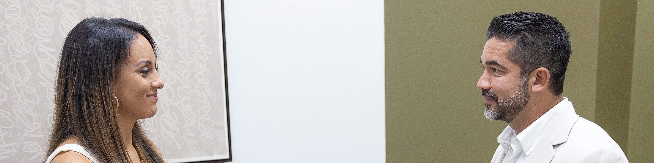 Two individuals engaged in conversation.