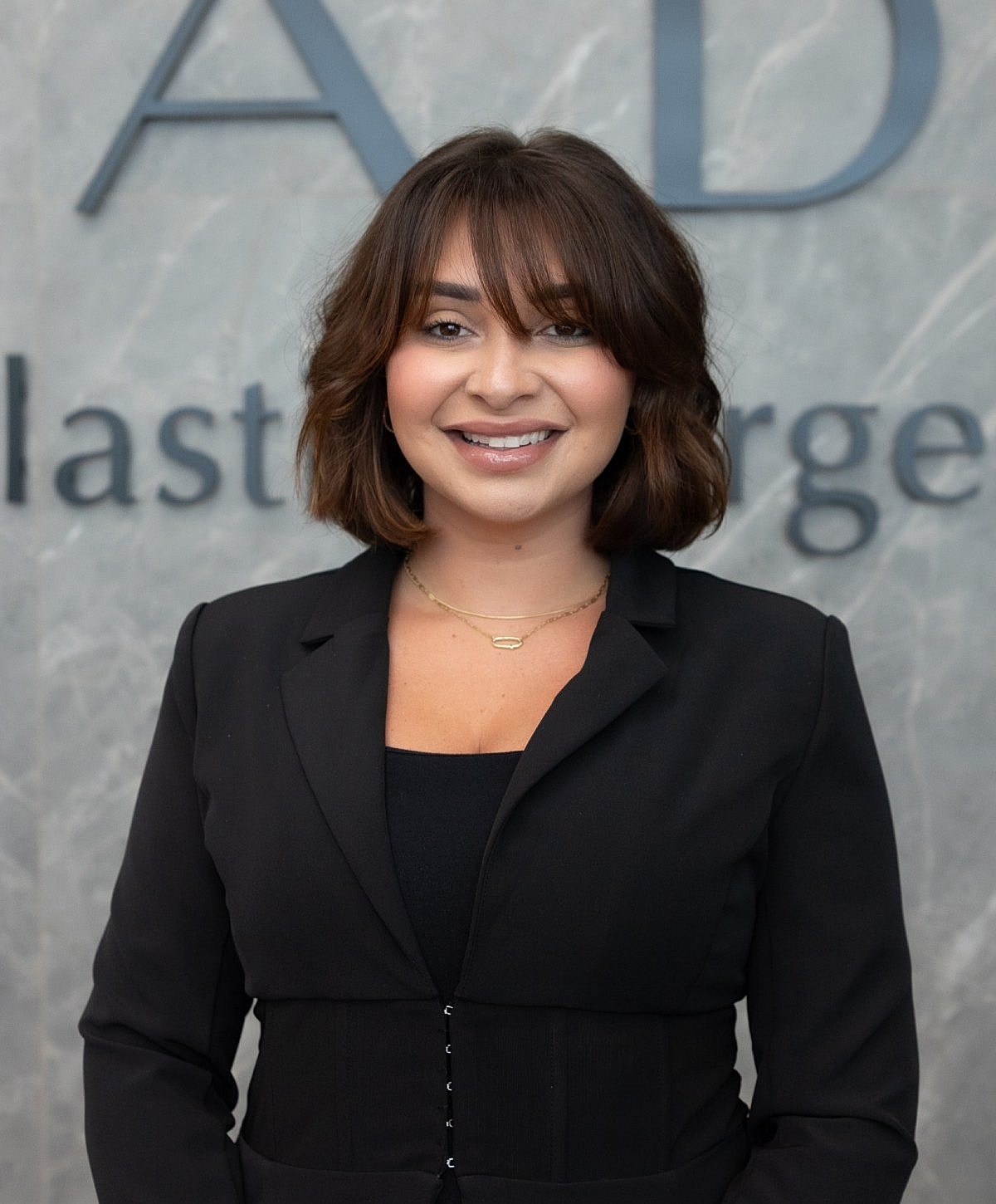 Professional woman smiling in an office setting