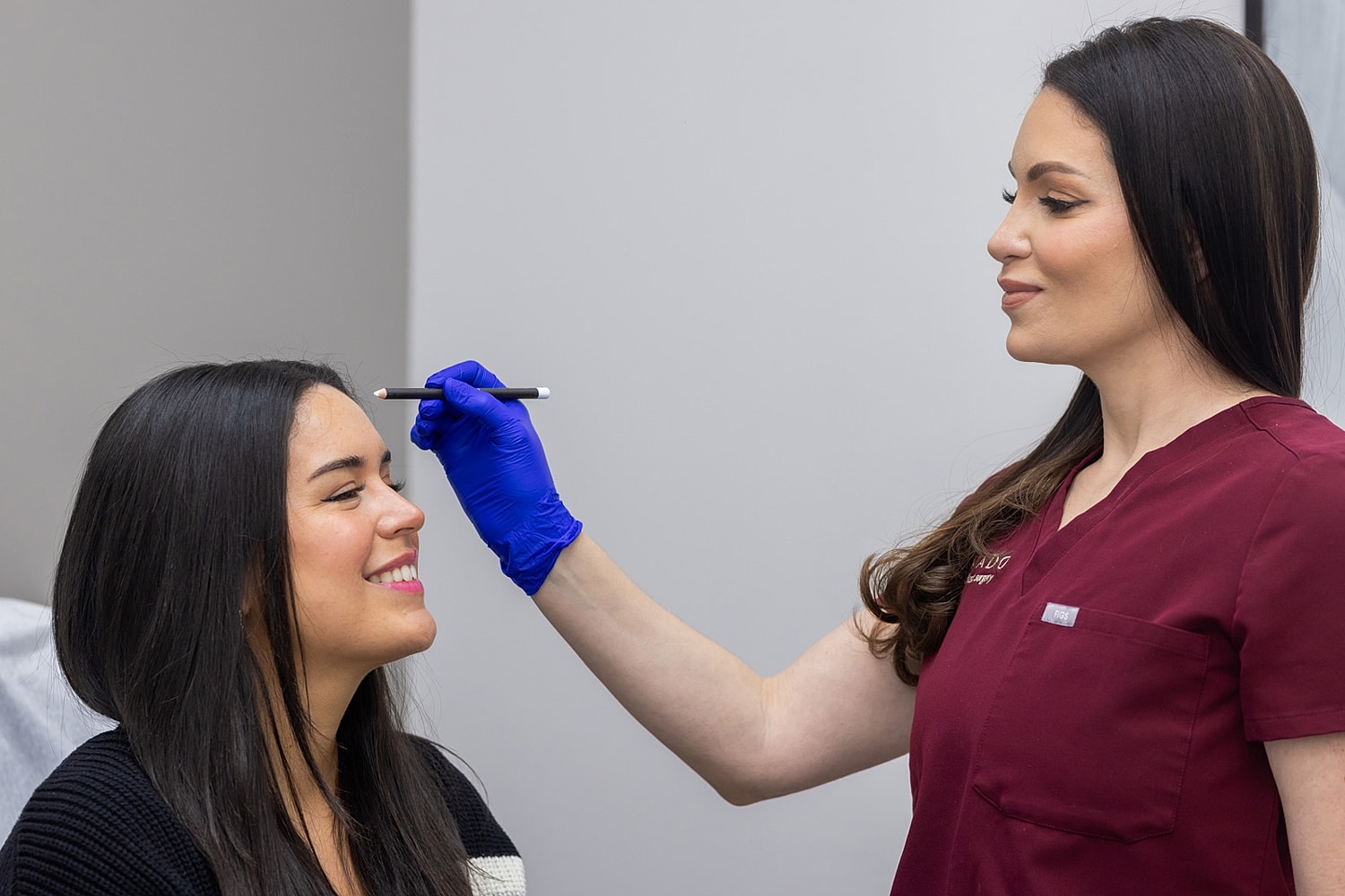 Client receiving makeup treatment from a professional.