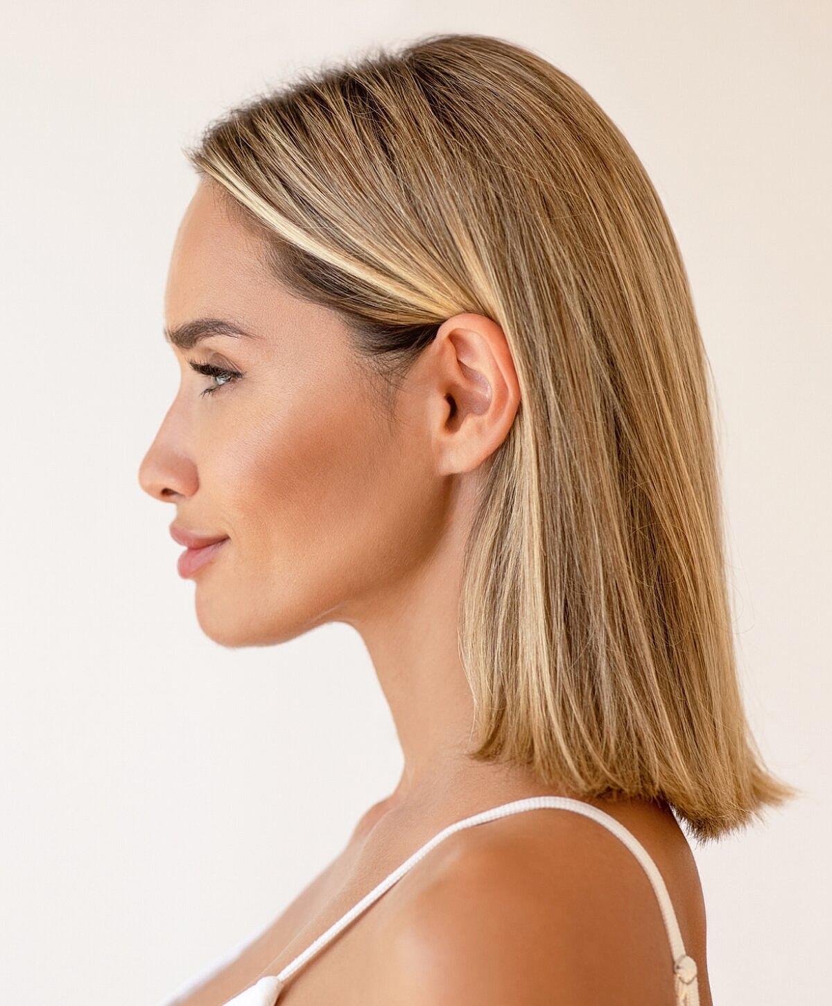 Profile view of a woman with blonde hair.