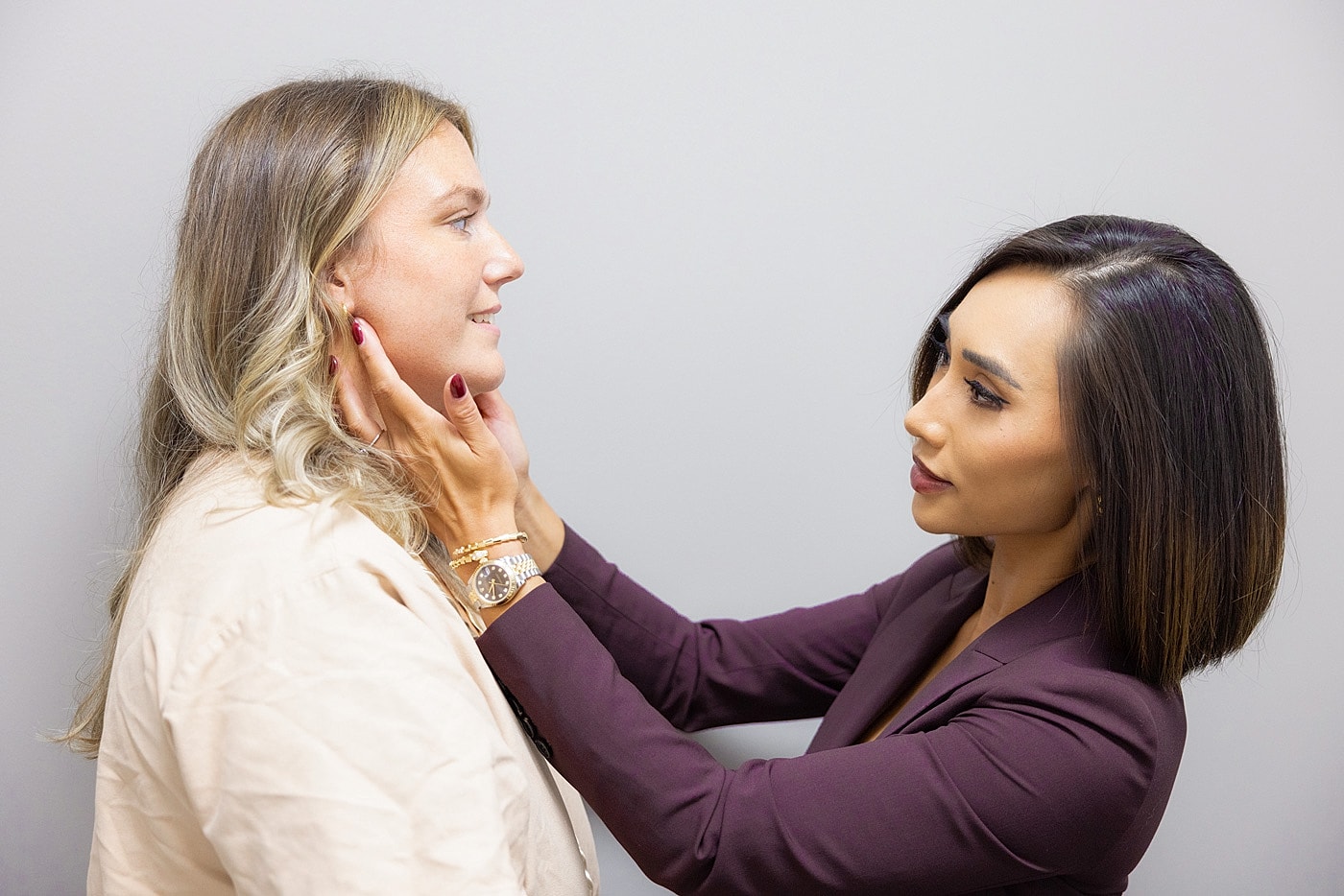 Beauty consultation between two women.