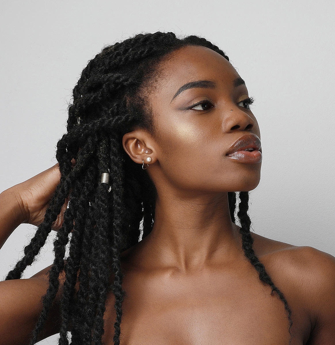 Portrait of a woman with braided hair.