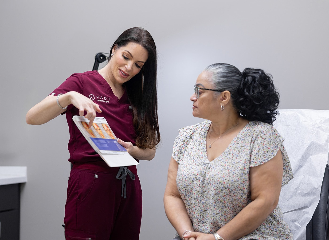 Consultation in a plastic surgery clinic setting.