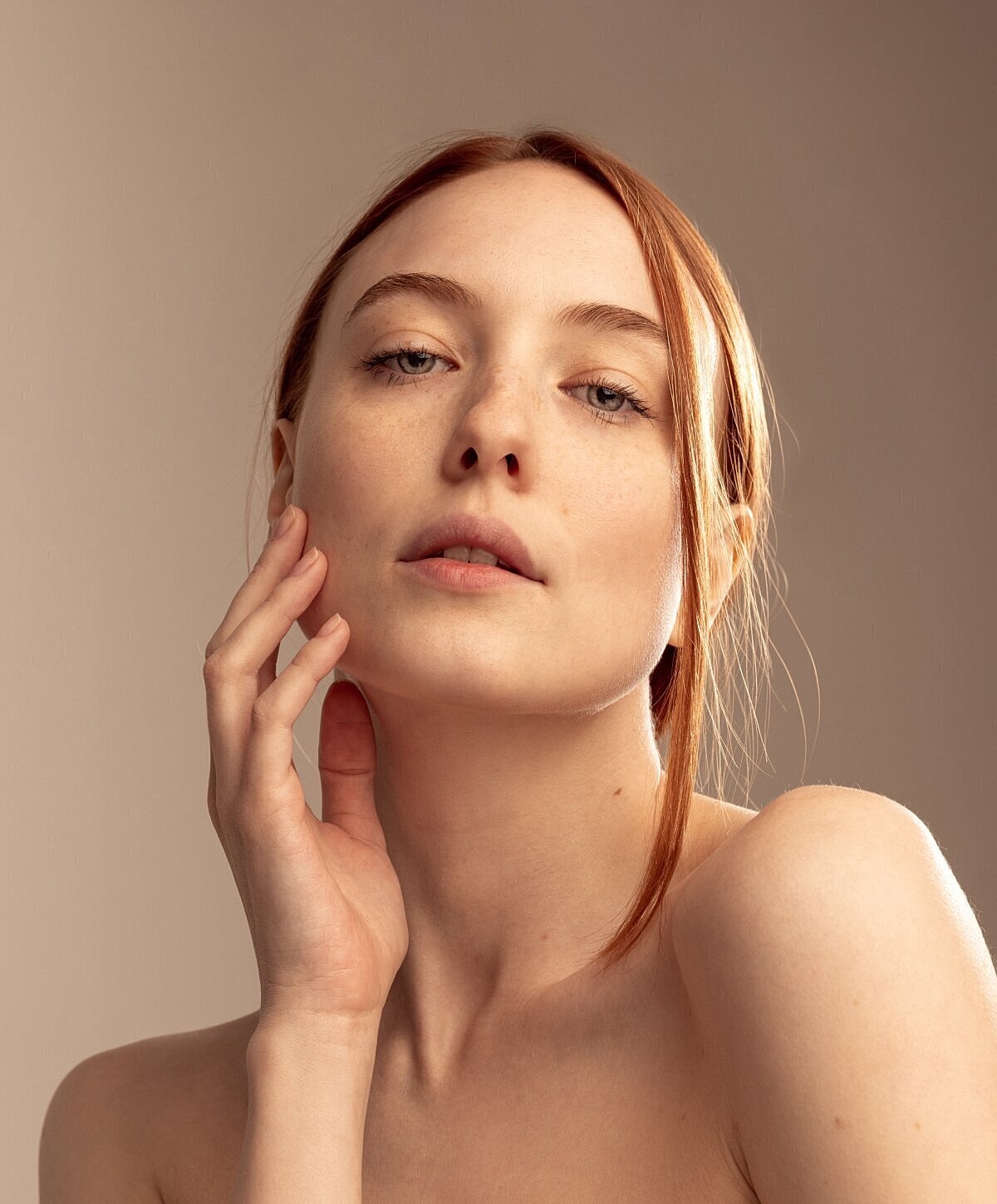 Portrait of a woman with red hair.