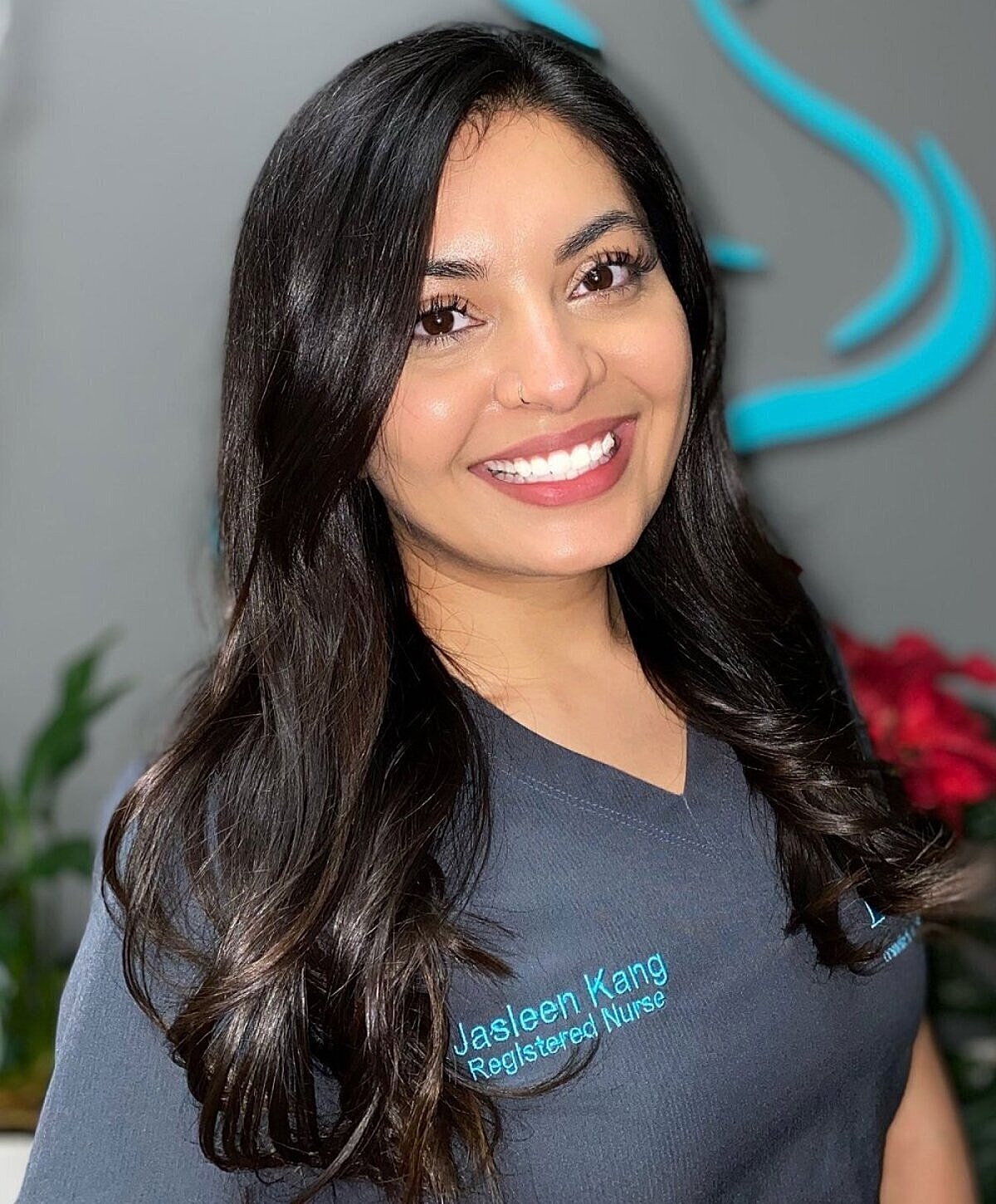 Smiling nurse in a professional setting.