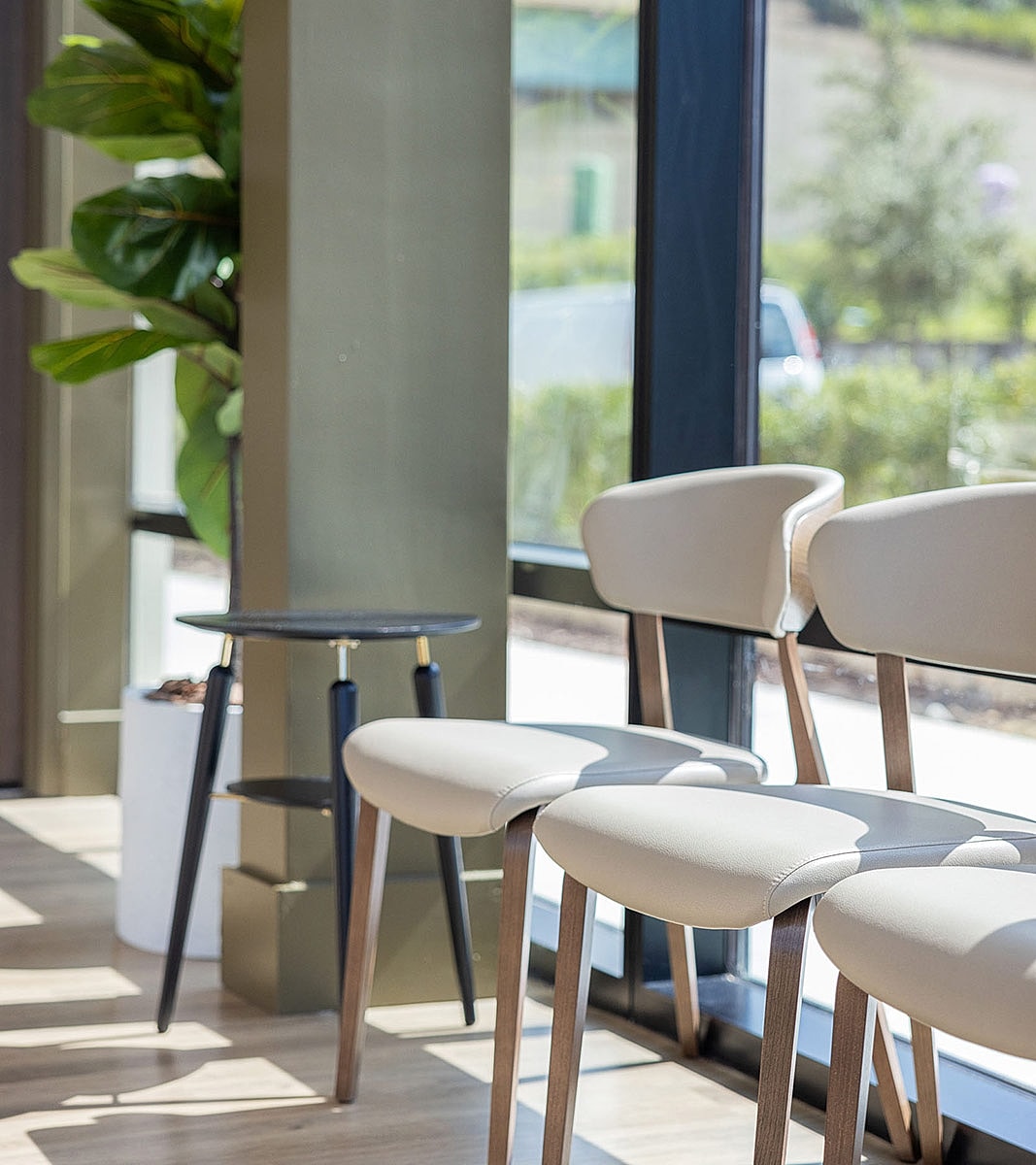 Modern chairs and table in bright interior setting