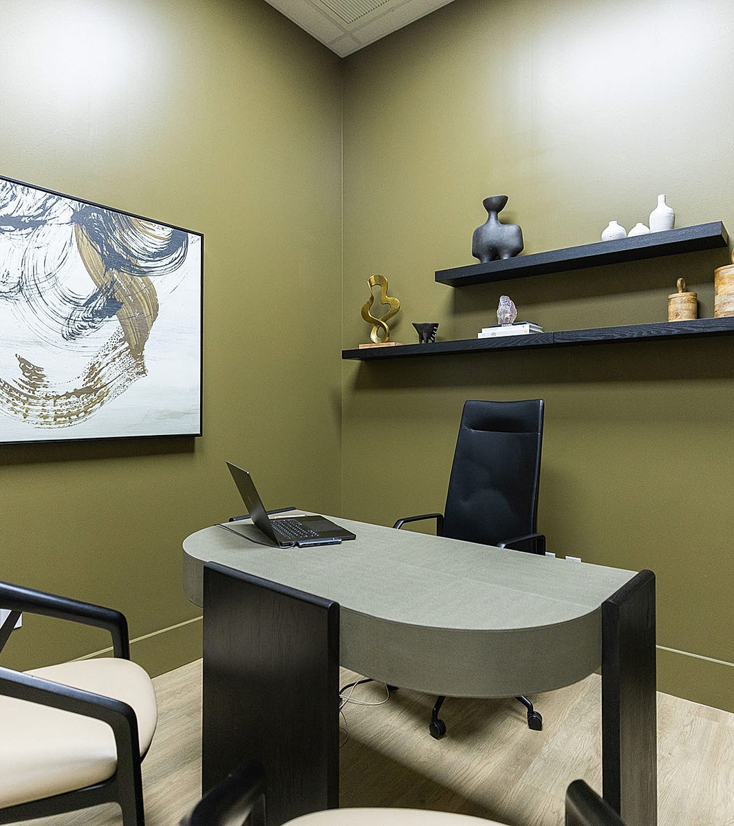 Modern office with minimalist decor and furnishings.