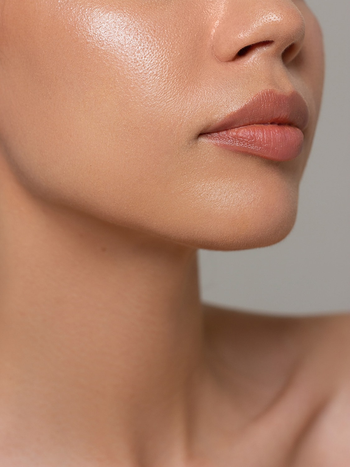 Close-up of smooth, glowing skin and lips.