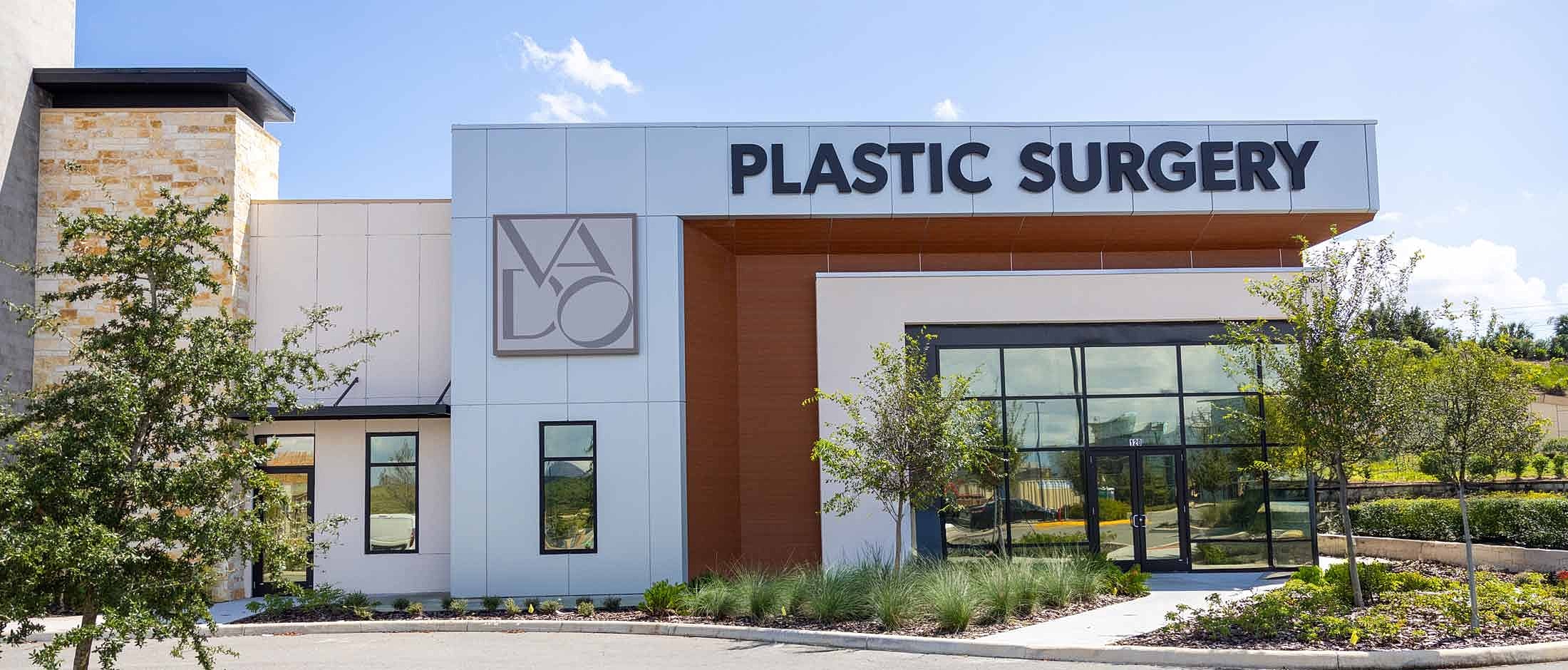 Plastic surgery clinic exterior with landscaping.