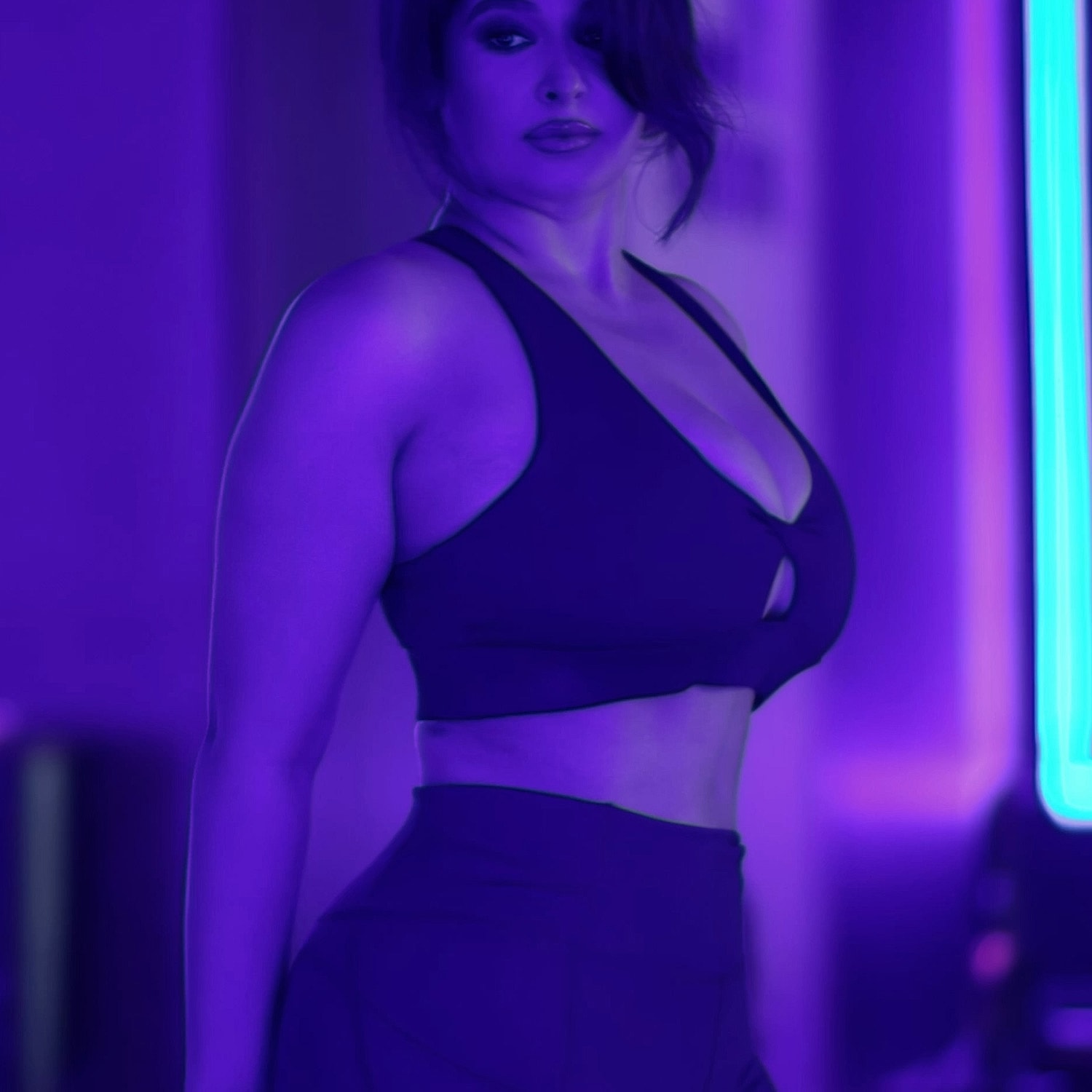 Woman in purple sportswear against colorful background.